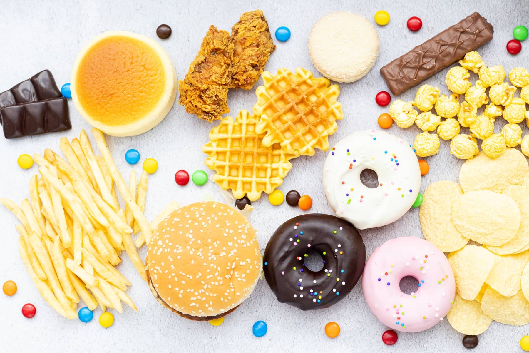 flat lay of unhealthy food from fast food sweets 2023 11 27 05 05 25 utc.jpg