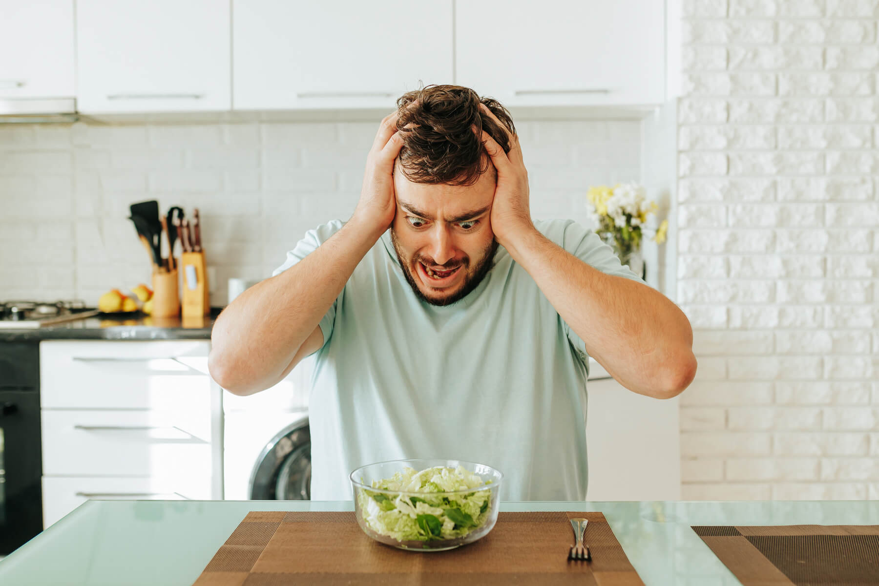 sitting in the kitchen a young man looks with hor 2023 11 27 05 19 51 utc.jpg